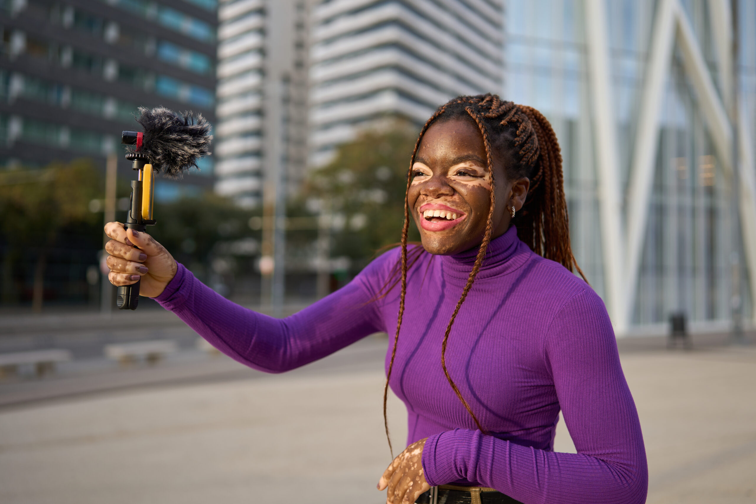 happy tik tok content creator with smartphone gimbal